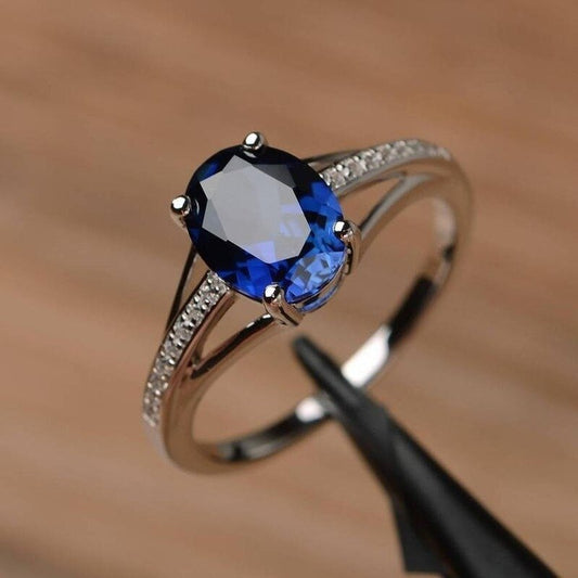 Elegant Oval Lab Blue Sapphire & CZ Crystal Silver Ring