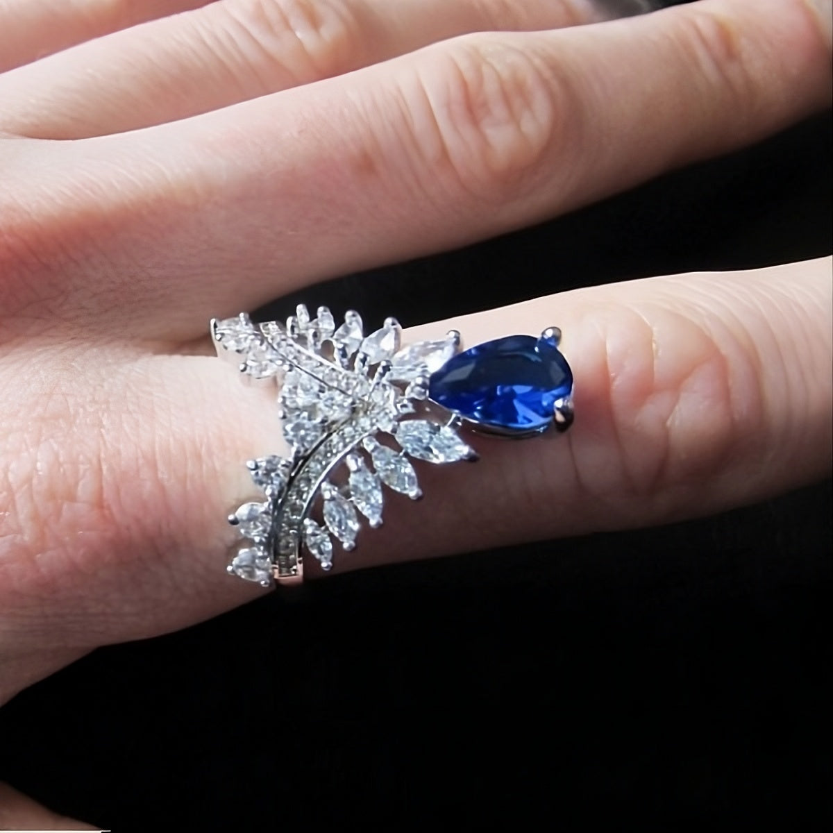 Blue Sapphire Pear Cut Crown Unique Silver Ring