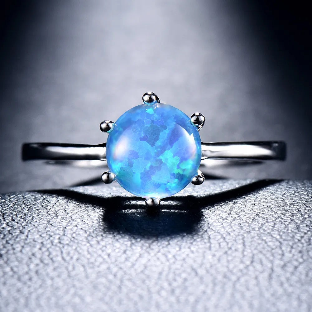 Round Blue Fire Opal Filled Six Claw Silver Ring