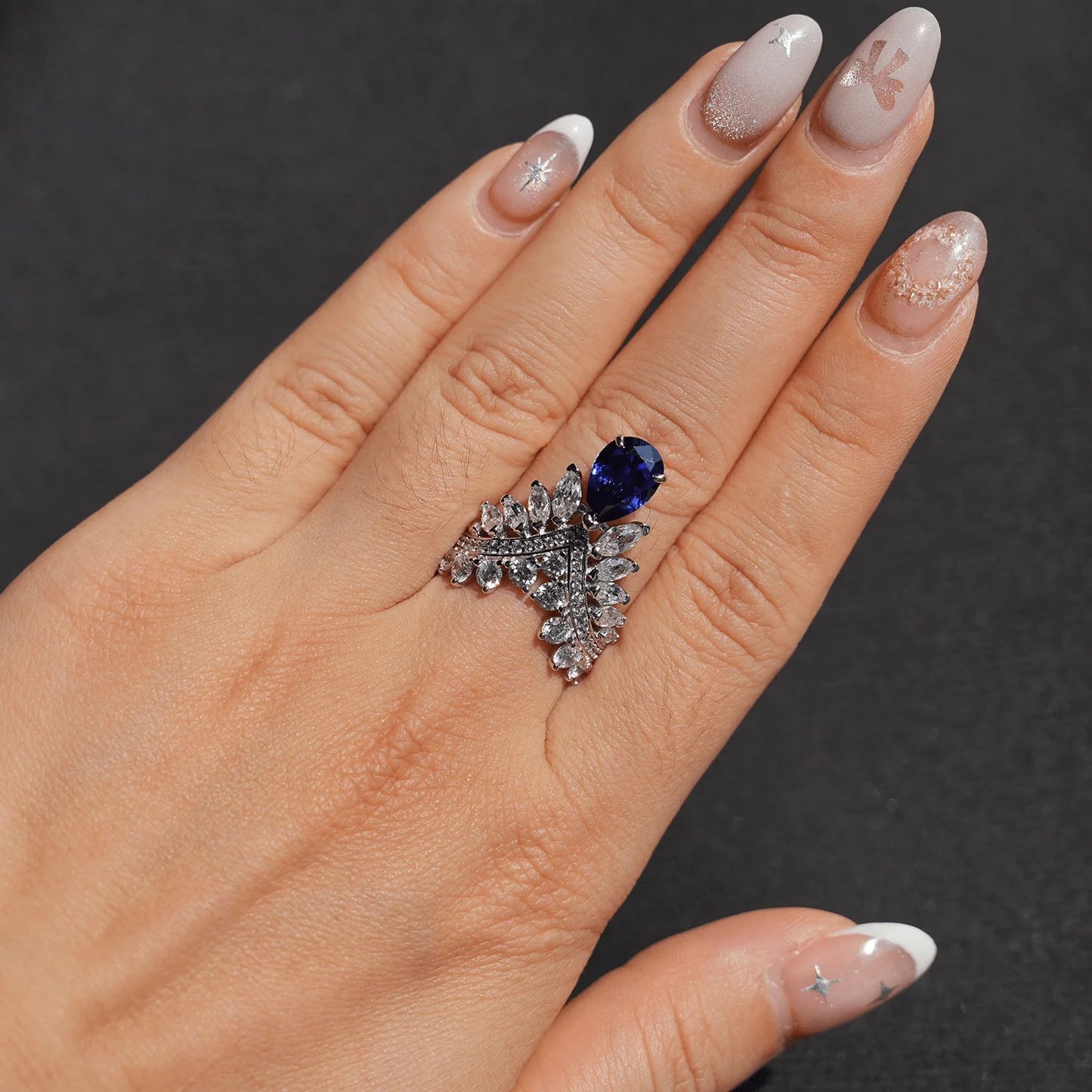 Blue Sapphire Pear Cut Crown Unique Silver Ring