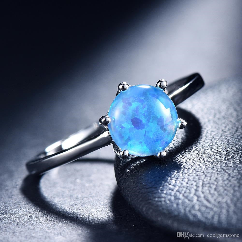 Round Blue Fire Opal Filled Six Claw Silver Ring