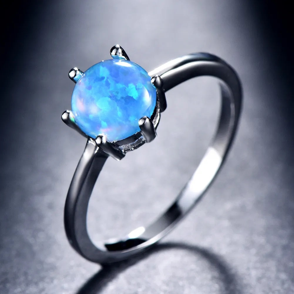 Round Blue Fire Opal Filled Six Claw Silver Ring